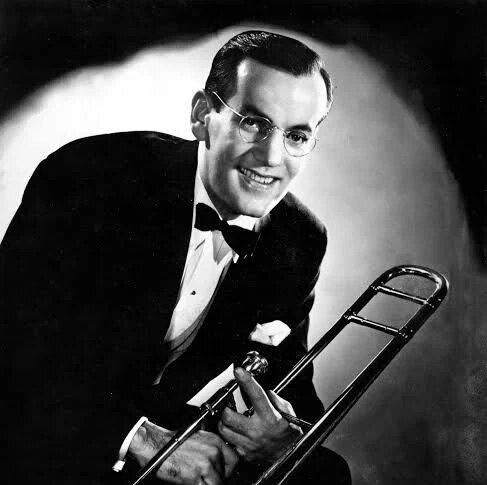 Black and white portrait of Glenn Miller holding his trombone